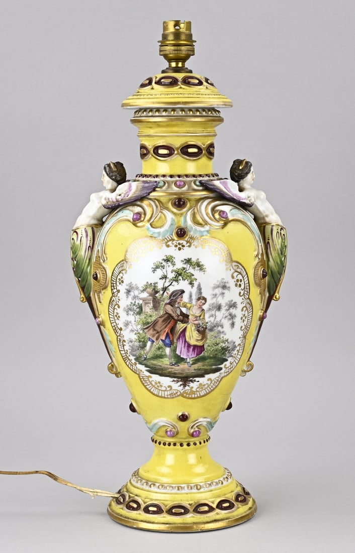 Porcelain lamp, H 43 cm.: Antique porcelain lamp base with figures in a landscape/caryatids and gold decoration. Circa 1880. Unmarked. Dimensions: H 43 cm. In good condition.