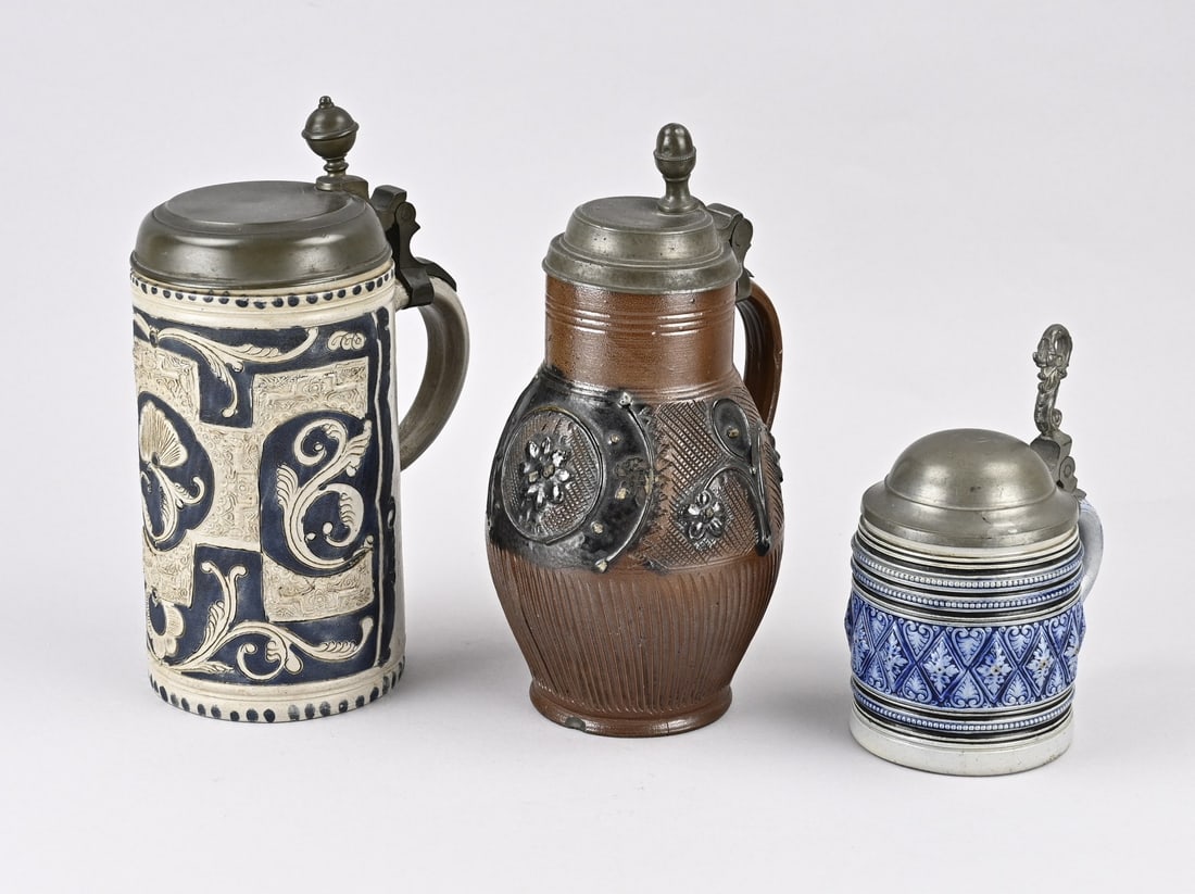 3x Antique German stoneware: Three antique German stoneware lidded jugs. 1x Westerwald humpen walzenkrug, circa 1800, with salt glaze. 1x Small Westerwald beer mug with pewter lid, circa 1880. 1x Brown glazed stoneware lidded jug