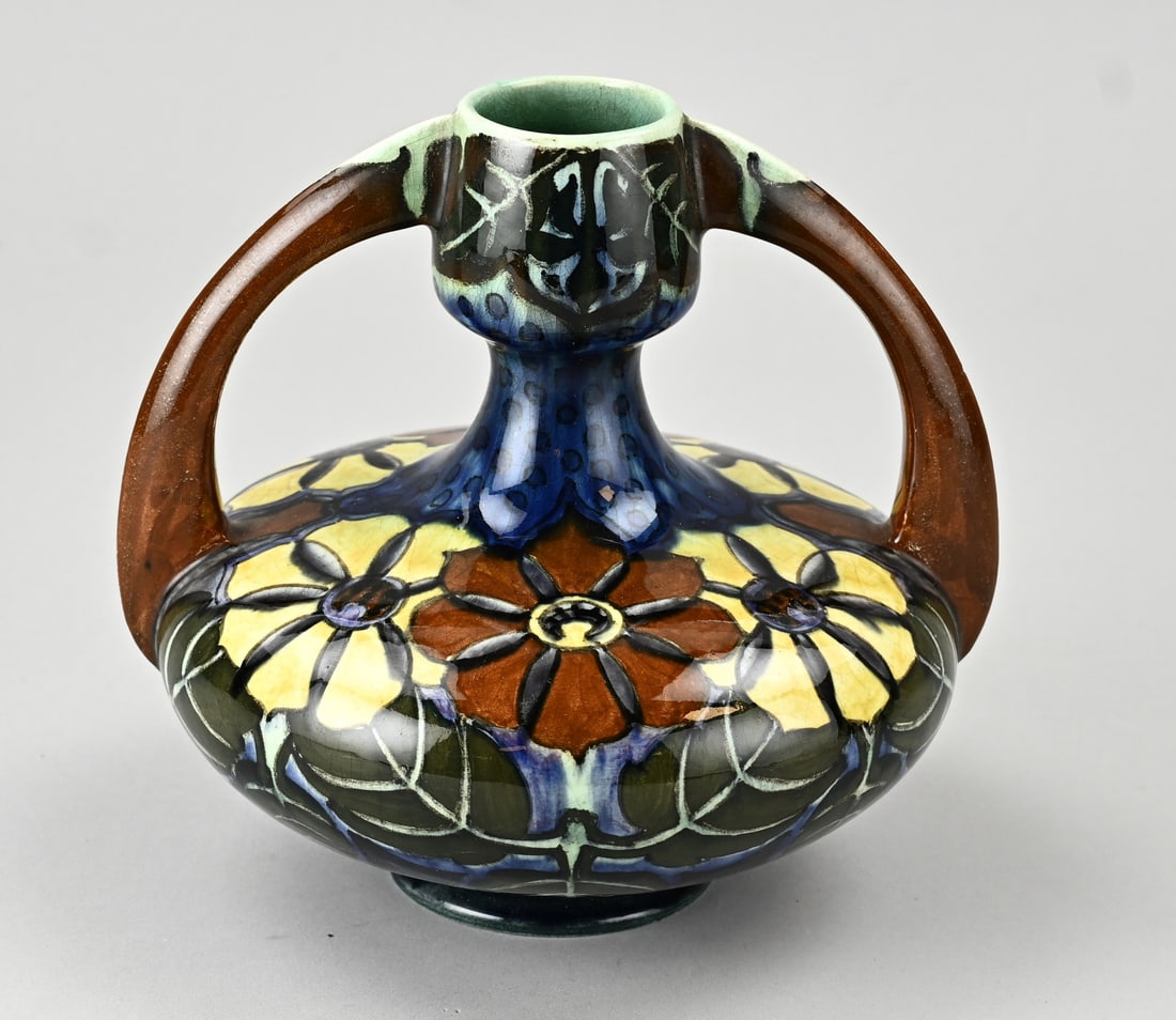 Rozenburg vase, H 17 cm.: Antique polychrome Rozenburg The Hague earthenware Art Nouveau ear vase with floral decoration. Circa 1900. No. 816 + painter's monogram. Dimensions: H 17 cm. In good condition.