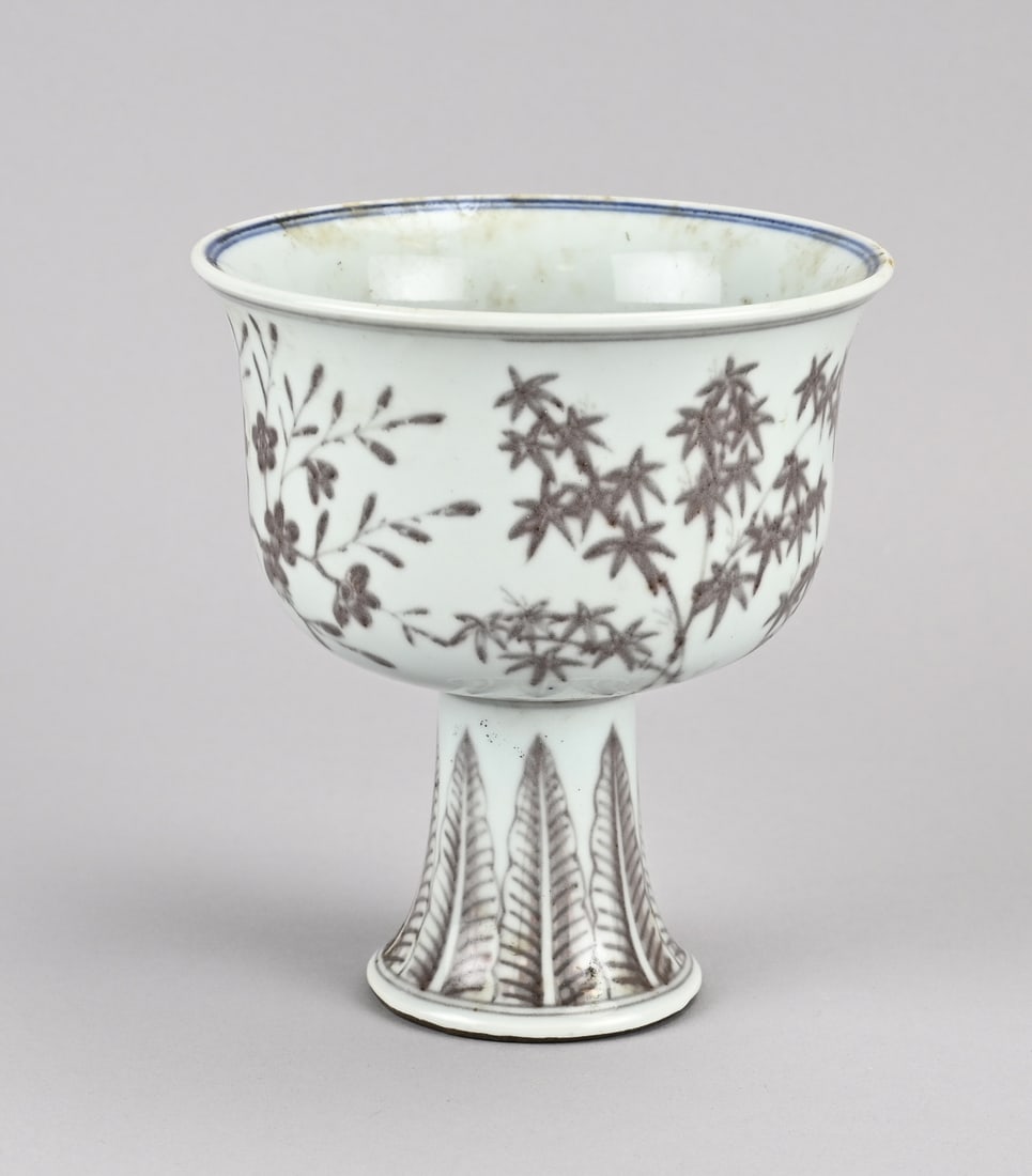 Chinese stem cup, 17 cm.: Large Chinese porcelain stem cup, oxidized red, with bamboo/pine tree decoration. Six-character base mark. Dimensions: 17 cm. In good condition.