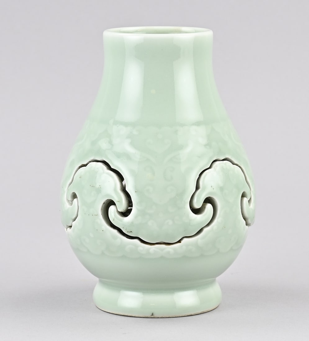 2-piece celadon vase, H 15.7 cm.: Old, two-piece Chinese celadon vase with floral relief decoration. Base mark. Dimensions: H 15.7 cm. In good condition.