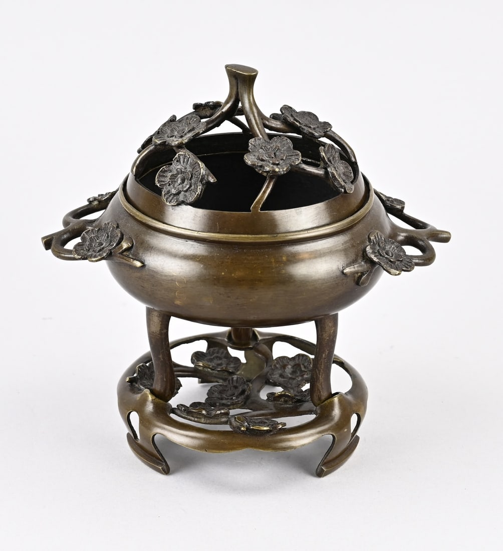 Chinese incense burner: Antique three-part Chinese bronze incense burner with prunus decoration. Dimensions: 19.5 x 19 x Ø 12 cm. In good condition.