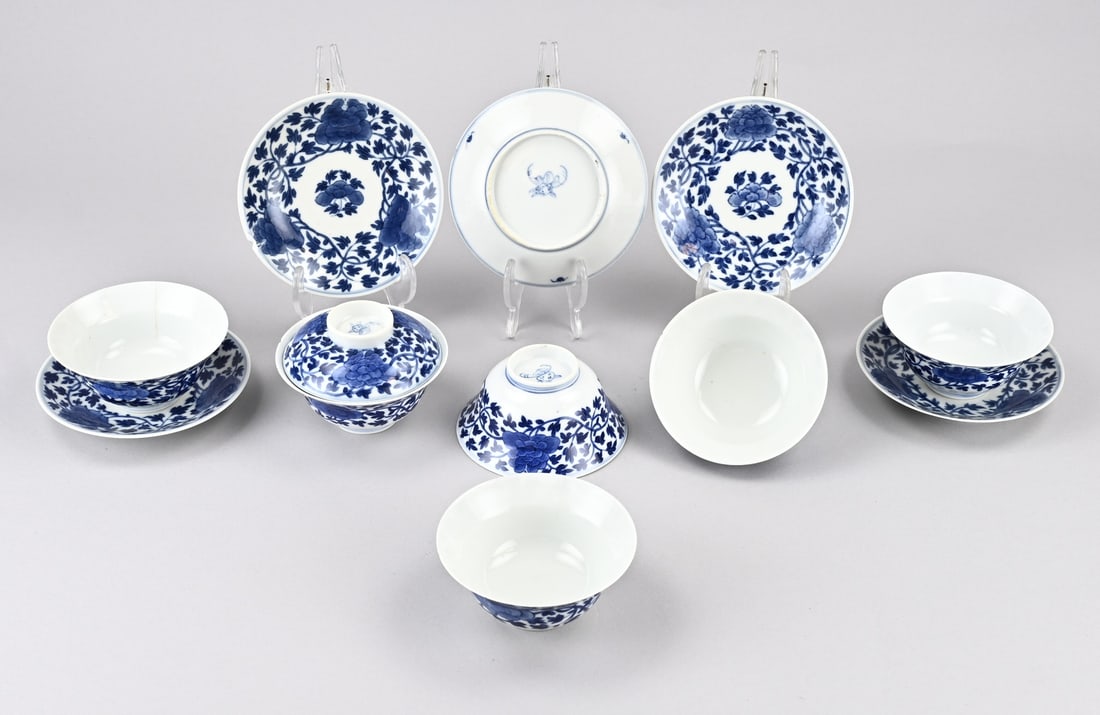 Set of Chinese cups and saucers: Set of 18th-century Chinese porcelain Kang Xi cups and saucers with peony decoration. Base mark. Six cups with hairline cracks/chips + one instance of damage. Five saucers, one of which is in good