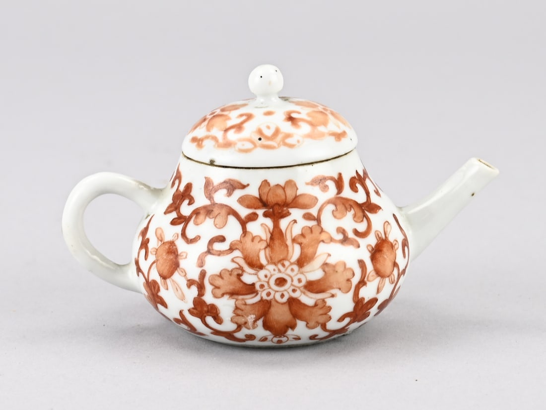 Chinese teapot: 18th - 19th Century Chinese porcelain teapot with floral milk/blood decoration. Dimensions: 7 x 11.5 x 7.5 cm. In good condition.