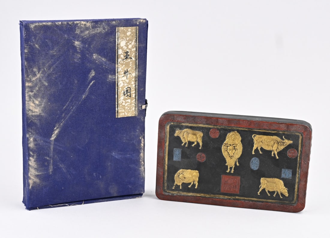 Chinese inkstone: Antique Chinese inkstone with relief cows/text, in a case. Dimensions: 16 x 24 x 3.5 cm. In good condition.
