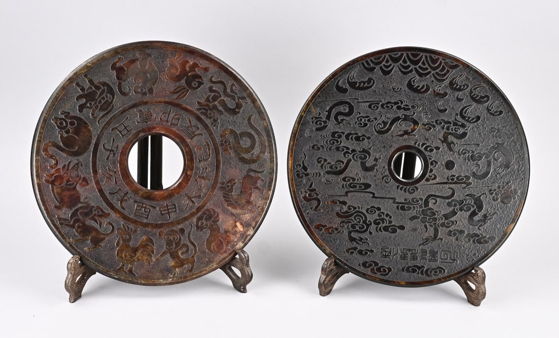 2x Chinese object (natural stone): Two large old Chinese natural stone discs with animal/dragon and text decoration. 20th century. Dimensions: approx. Ø 30 - 31 cm. In good condition.