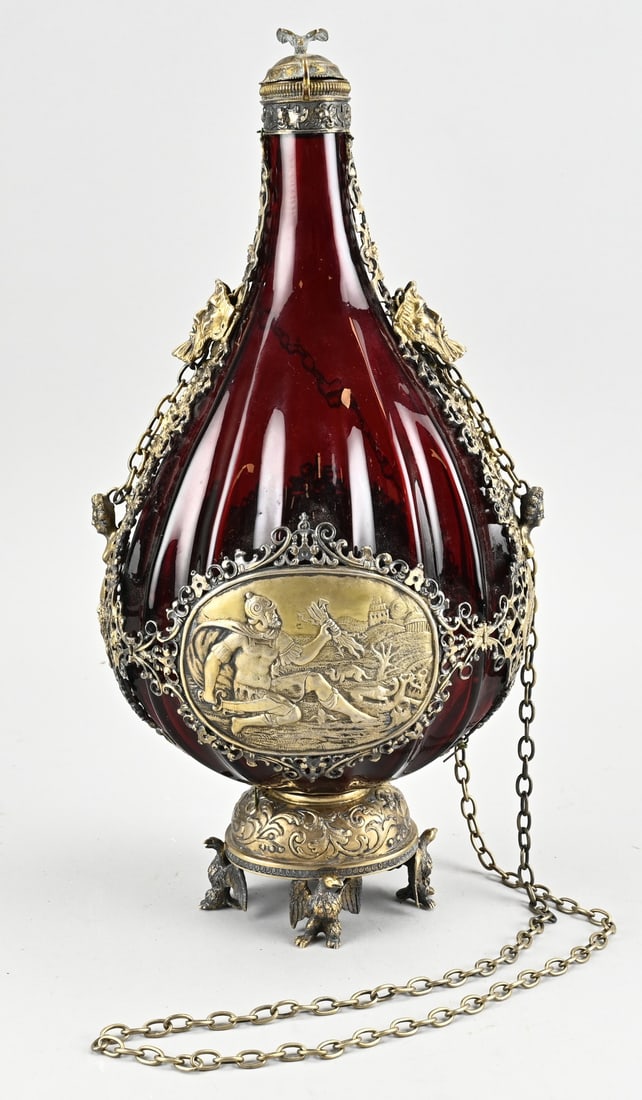 Rare Pilgrim's Flask: A remarkable 19th-century Austro-Hungarian pilgrim's flask of ruby red glass with silver-gilt decoration on two oval panels adorned with classical scenes set within a hinged rim with mask heads and