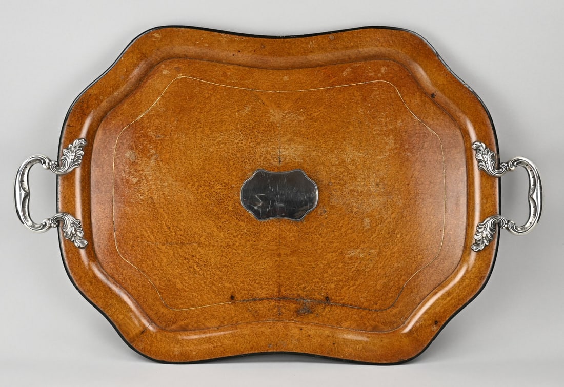 Tray with silver: Large silver tray, 833/000. Rectangular contoured wooden tray with silver handles featuring acanthus leaves. And a silver element in the center. MT.: A.Bonebakker, Amsterdam, dated:0:1873. Shop mark: