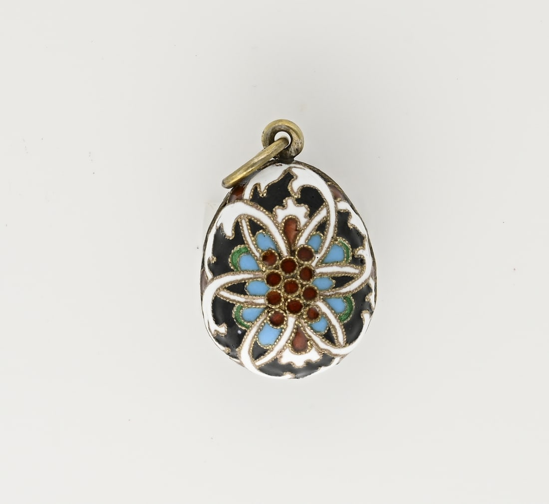 Silver egg pendant with enamel: Silver egg pendant, 84 zolotniks, decorated with enamel in various colors in floral shapes. 32x18mm. Including loop. In good condition.