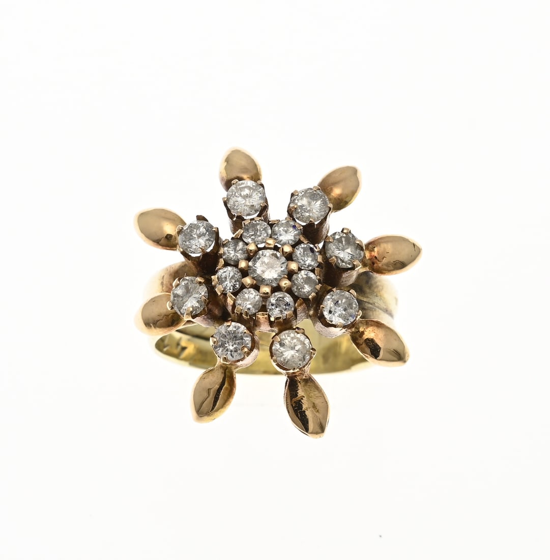 Gold rosette ring with diamonds: Yellow gold ring, 585/000, with a flower and diamonds. Ring made from two wedding rings topped with a flower-shaped element set with a double rosette set with brilliant-cut diamonds. Total approx.