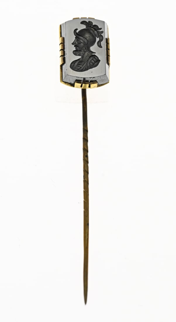 Pin with itaglio: Gold-plated brooch with a carved hematite stone, 11x17mm, with an itaglio of a warrior. Circa 1900. In original case.