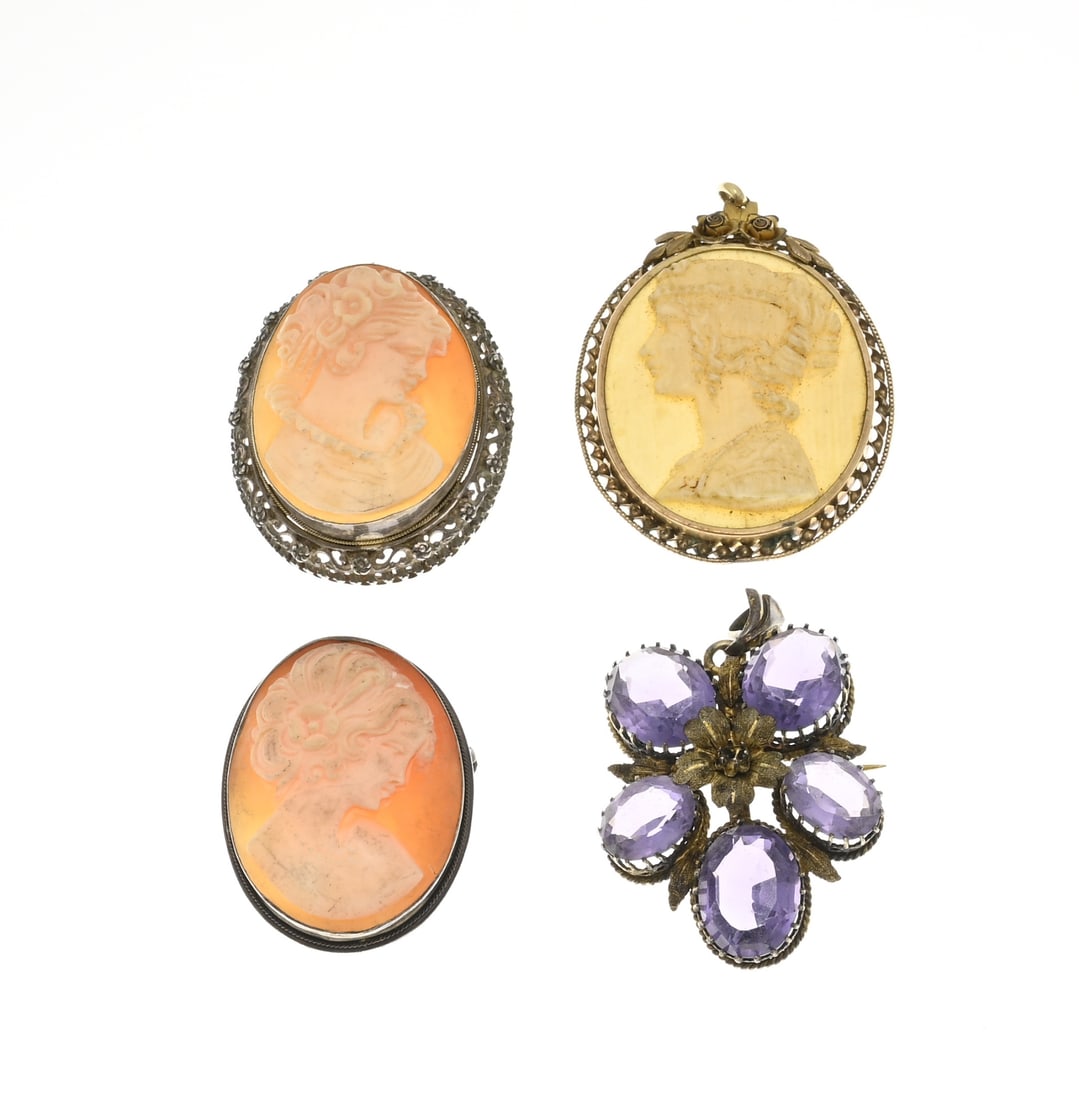 4 Pendants/brooches: Four brooches/pendants, 3 with cameos and a flower-shaped brooch with purple stones. In good condition.