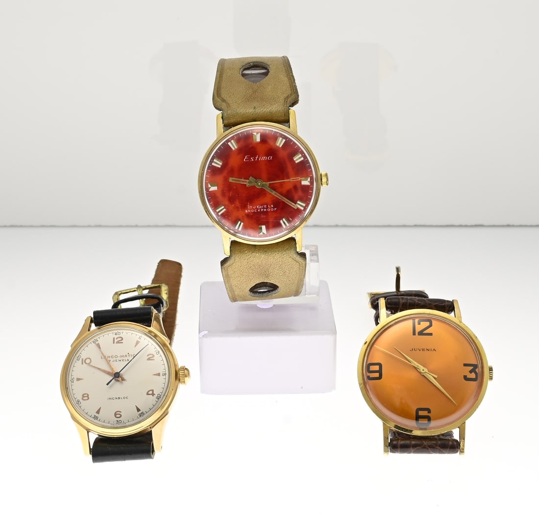 3 Watches: Lot of three gold-colored watches, Lanco-matic, a watch with a red dial, Estima, and a watch with an orange dial, Juvenia. With leather straps. Working.