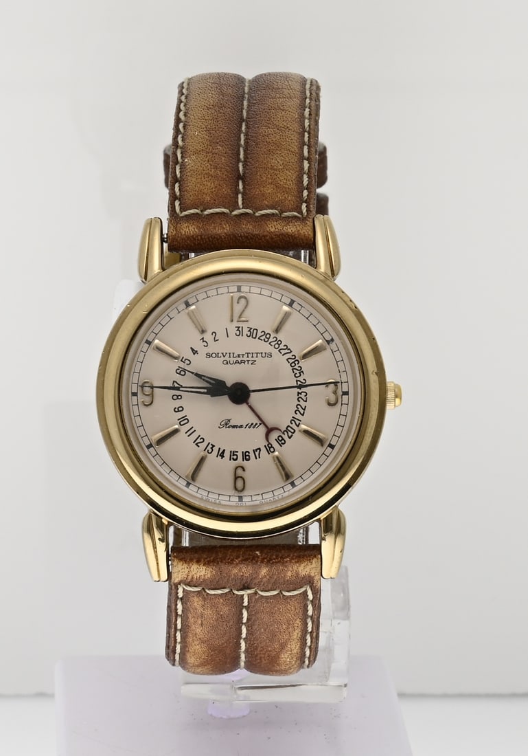 Solvil & Titus watch: Elegant Solvil & Titus watch, quartz, with a gold-plated round case, ø 31 mm. Featuring a pink dial with a date indicator hand. Mounted on a brown leather strap. Case number: 06-0017 116218.