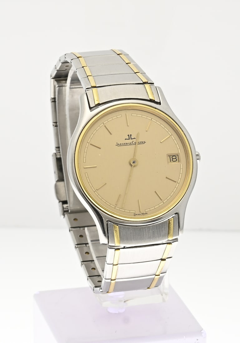 Jaeger-Le Coultre watch: Beautiful Jaeger-LeCoultre Heraion watch, steel with gold. Quartz. Features a gold-colored dial with a date display. Case diameter 33 mm. Length 20 cm. Case number: 141.113.5 / 1589951. In good