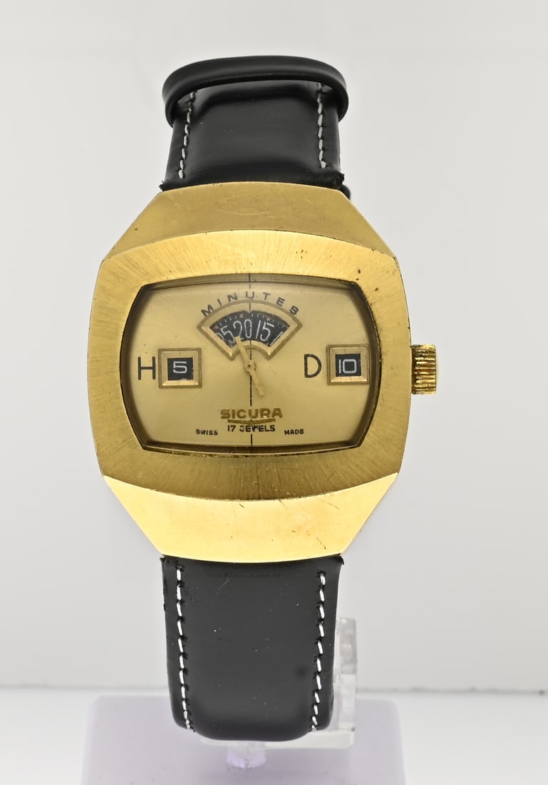 Vintage double watch: Vintage double watch, Sicura, mechanical, with a contoured case and a distinctive dial. Mounted on a black leather strap. Width 36 mm. Case slightly scratched, otherwise in good condition.