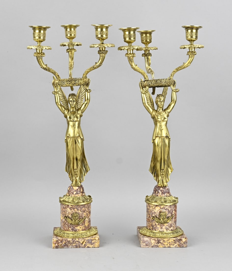 2x Empire candlestick, H 47 cm.: Two 19th-century bronze Empire candlesticks with marble and large angels. Dimensions: H 47 cm. In good condition.
