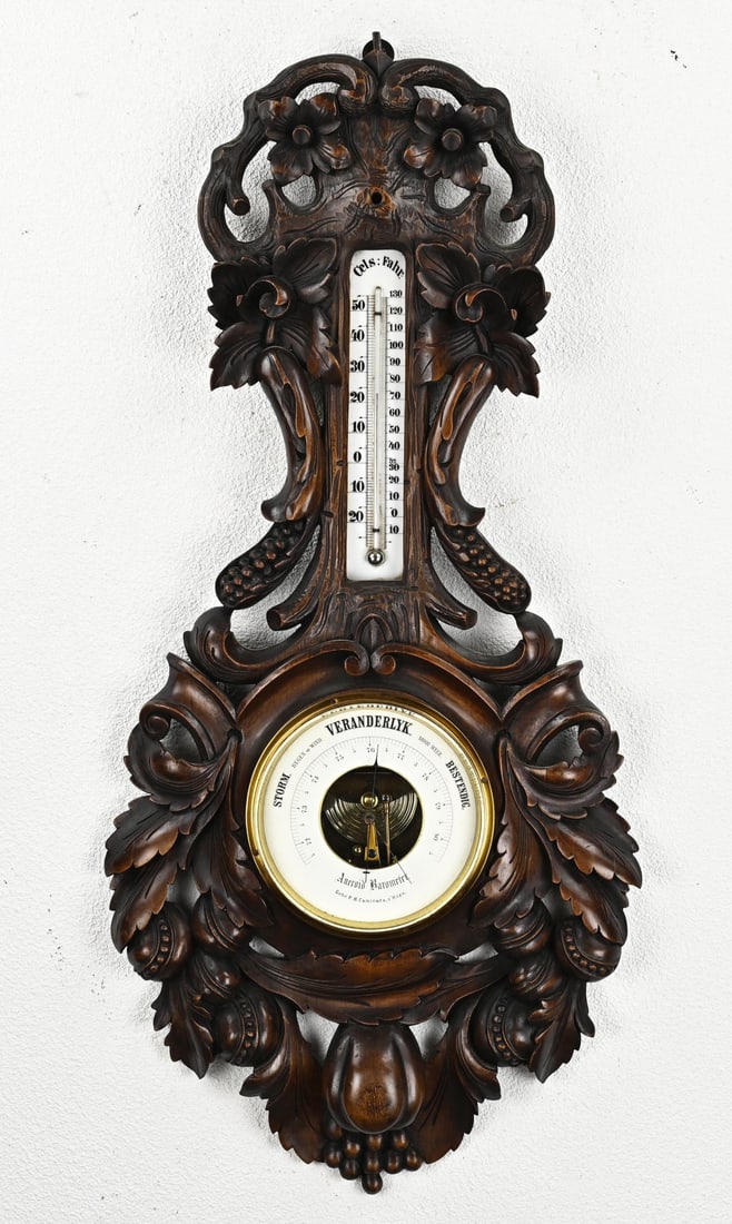 Black Forest barometer, 91 cm.: Exceptionally large and antique walnut Black Forest barometer with fruit vines + Netherlands inscription Gebr. PH Caminada 's Hage. Dimensions: 91 cm. In good condition.