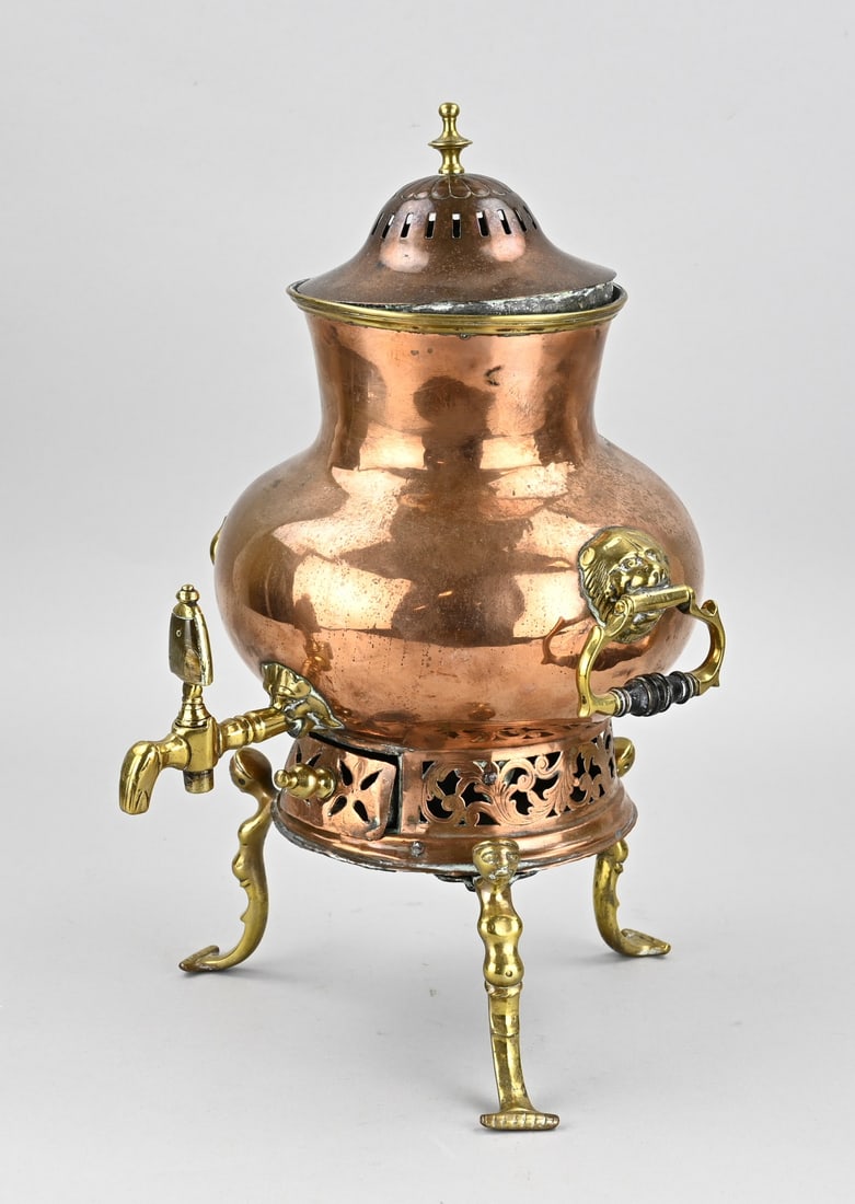 Old brass spouted jug, H 38 cm.: 17th-century, late Gothic/Renaissance brass spouted jug with bodies as legs, with a horn spout, tendrils, and lion's heads. With handles. Dimensions: H 38 cm. In good condition.