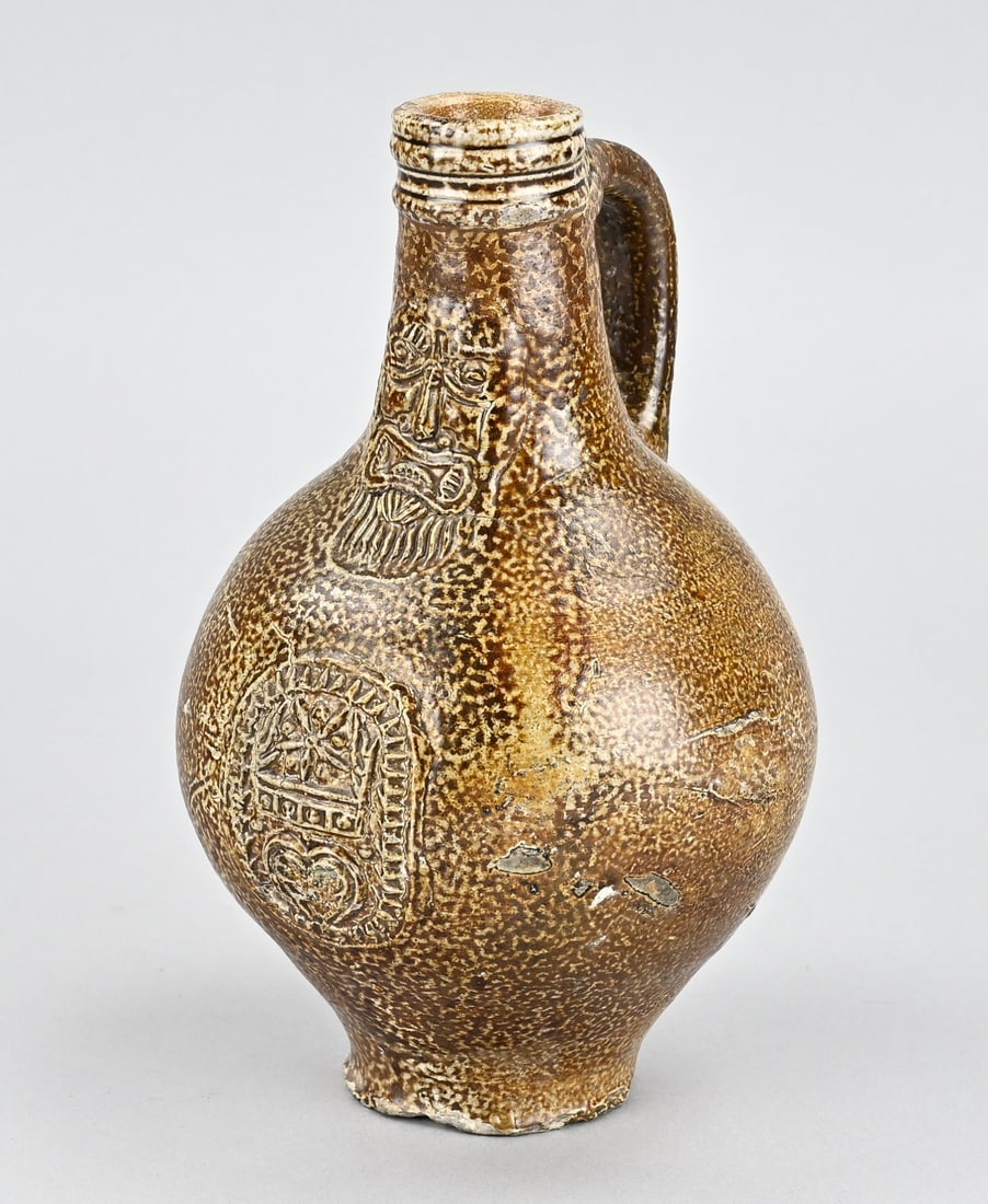 Bearded man jug, H 20.5 cm.: Small 17th-century German Frechen stoneware bearded man jug with medallion. Dimensions: H 20.5 cm. Older restoration. In good condition.