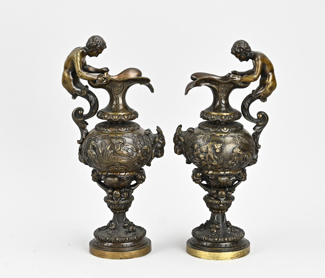 2x Antique bronze pitcher: Two antique bronze pitchers with faun and animal decoration. Detailed. 19th century. Dimensions: H 23 cm. In good condition.