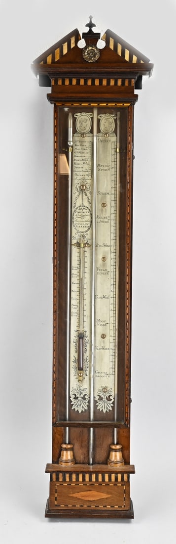 Barometer: 18th - 19th Century Dutch box barometer by F. Tachi Zierikzee. Mahogany + intarsia. Older restoration. Lower finials are missing. Dimensions: 113 cm. In good condition.