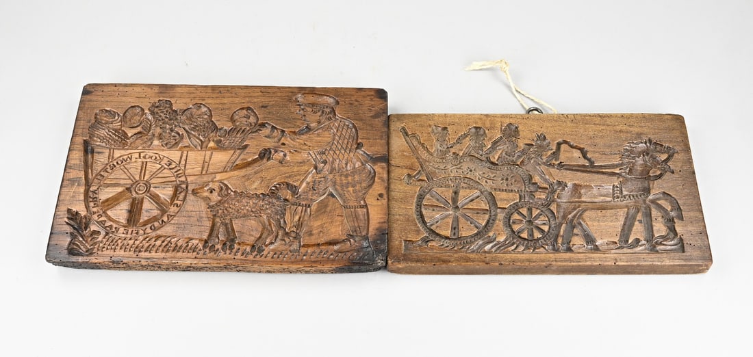 2x Cookie board: Two 19th-century, double-sided speculaas cookie molds made of elm wood, with beautiful figural depictions. Dimensions: 36 x 39 cm. In good condition.
