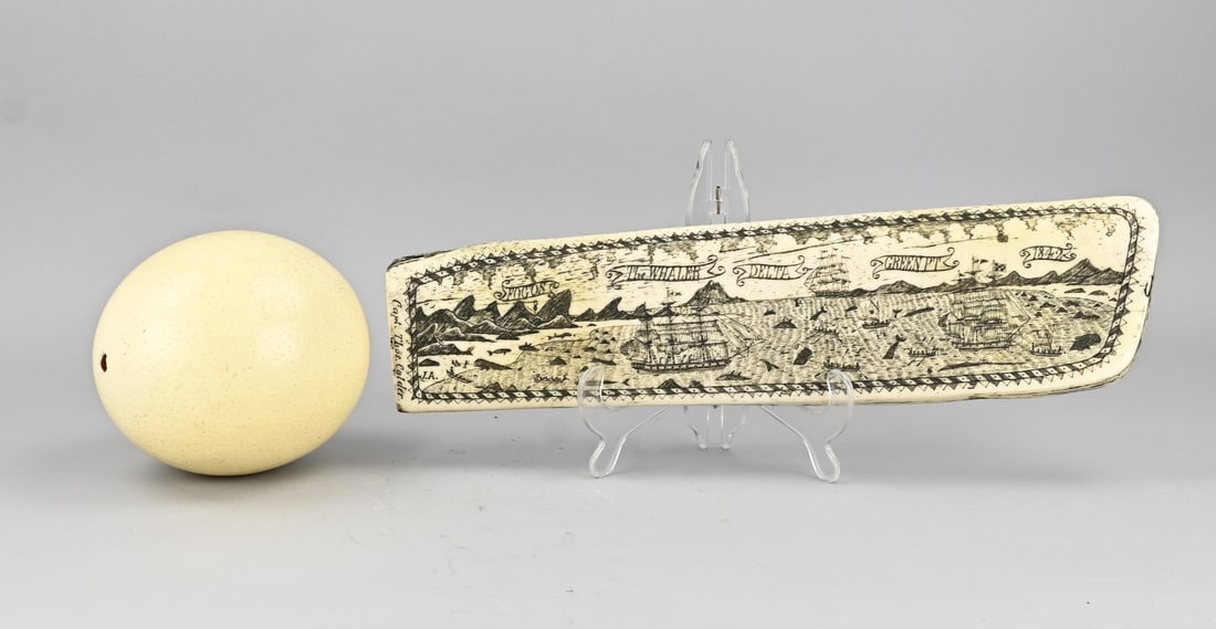 Ostrich egg + whaling object: 2x Miscellaneous. 1x Real ostrich egg. 1x Decorated replica leg, related to whaling. Dimensions: 15 - 42 cm. In good condition.