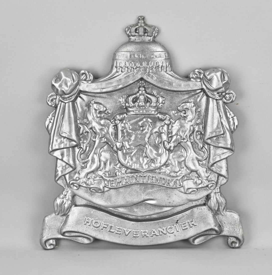 Royal Warrant Holder shield: Aluminium Purveyor to the Royal Household shield. 21st century. Dimensions: 50 x 43 x 3.5 cm. In good condition.