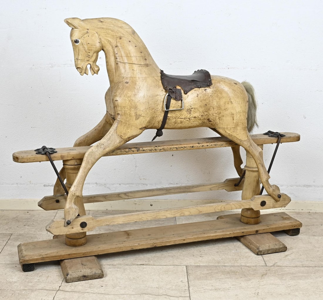 Rocking horse, 1920 - 1930: Antique wooden rocking horse with original saddle and reins. Possibly by FH Ayres. Circa 1920 - 1930. Dimensions: 100 x 125 x 38 cm. In good condition.