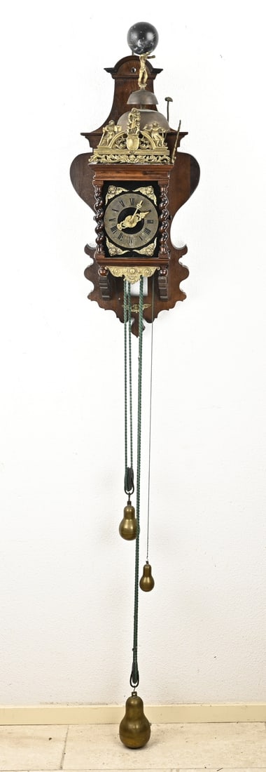 Zaanse wall clock, 87 cm.: Very large Zaanse wall clock made of walnut, with double bell + alarm. 20th century. Dimensions: 87 cm. In good condition.