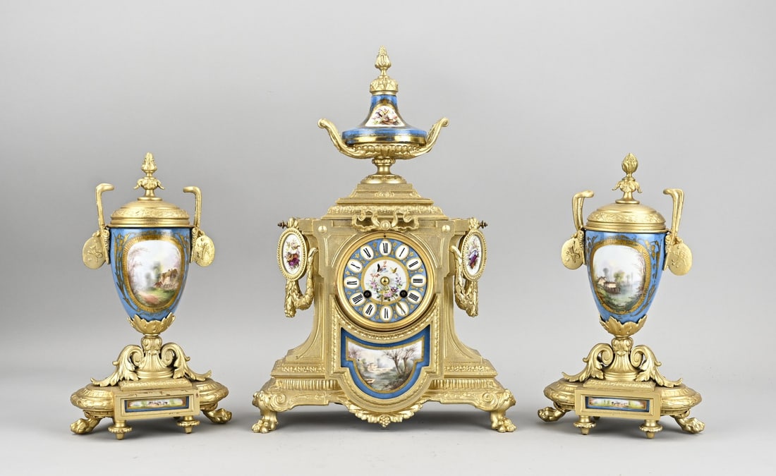 3-piece Sevres mantel clock set, 1880: Antique three-piece Sevres porcelain + composition metal clock set. France. Circa 1880. Eight-day movement, half-hour strike, spring pendulum. Dimensions: H 29 - 41 cm. Gilding restored. In good
