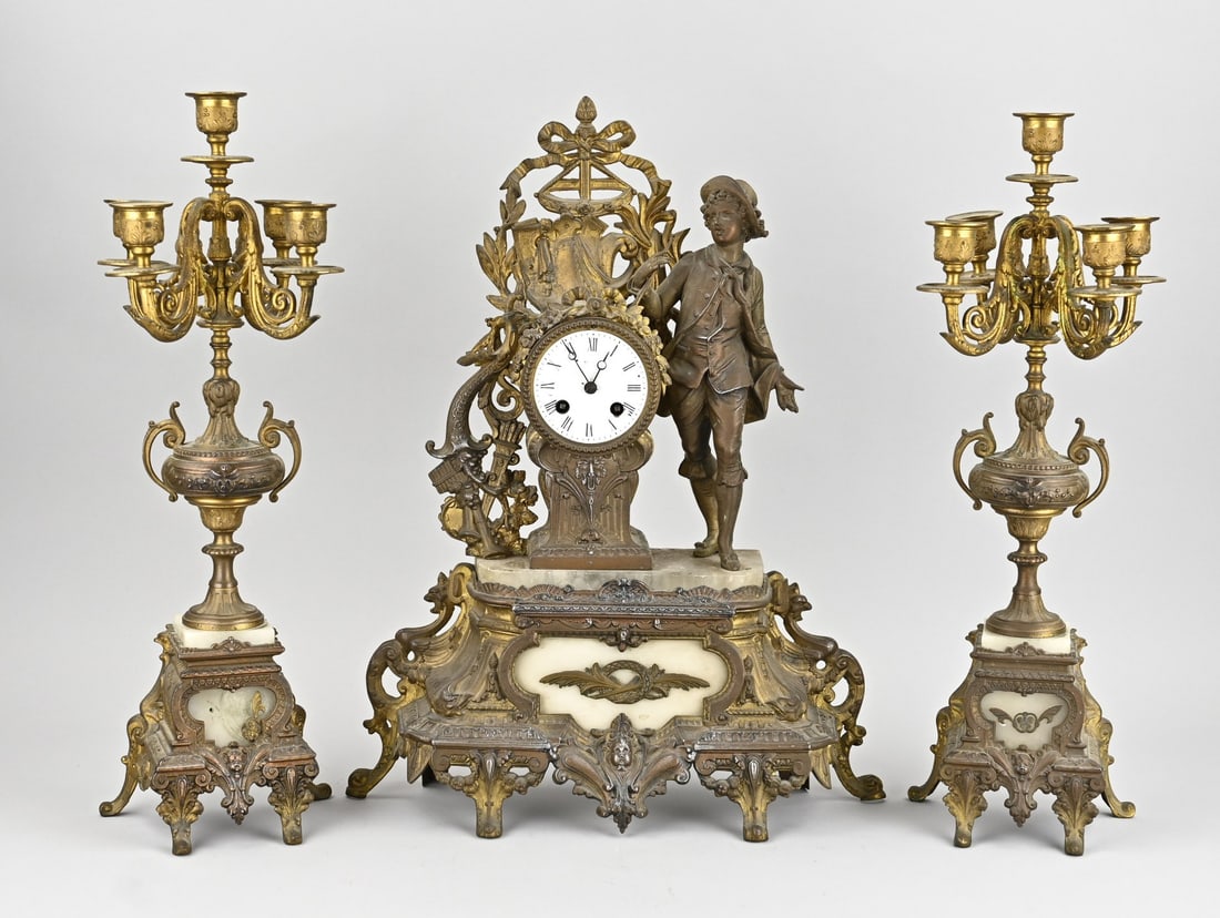 French clock set, 1870: Antique, French, composition metal Louis Philippe clock set with alabaster. Circa 1870. Dimensions: H 50 - 51 cm. Uncleaned. In good condition.