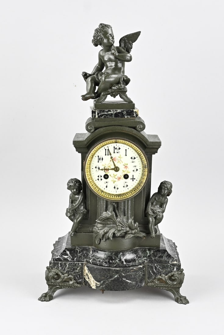 French pendulum clock, H 52 cm.: Antique, French, composite metal pendulum clock with marble. With angel and putti. Circa 1890. Eight-day movement, half-hour strike. Marble damaged at corner. Dimensions: H 52 cm. In reasonable