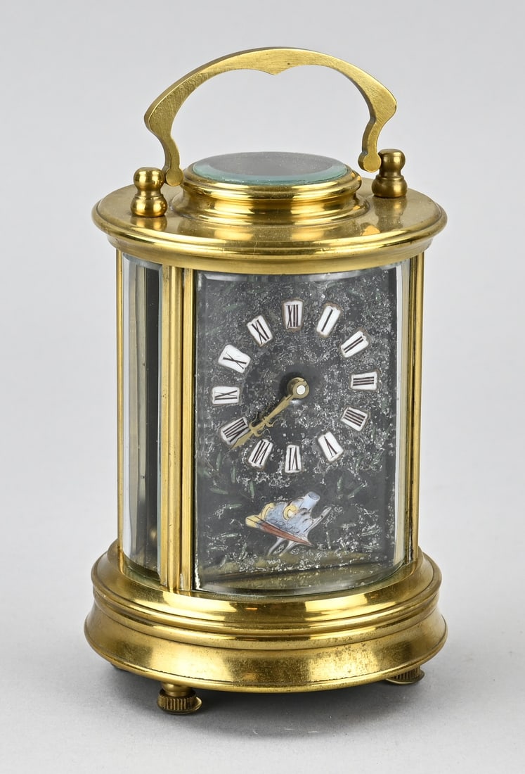 French travel alarm clock: Reproduction, French oval brass travel alarm clock with silent movement. Second half of the 20th century. Dimensions: 17 x Ø 9 cm. In good condition.