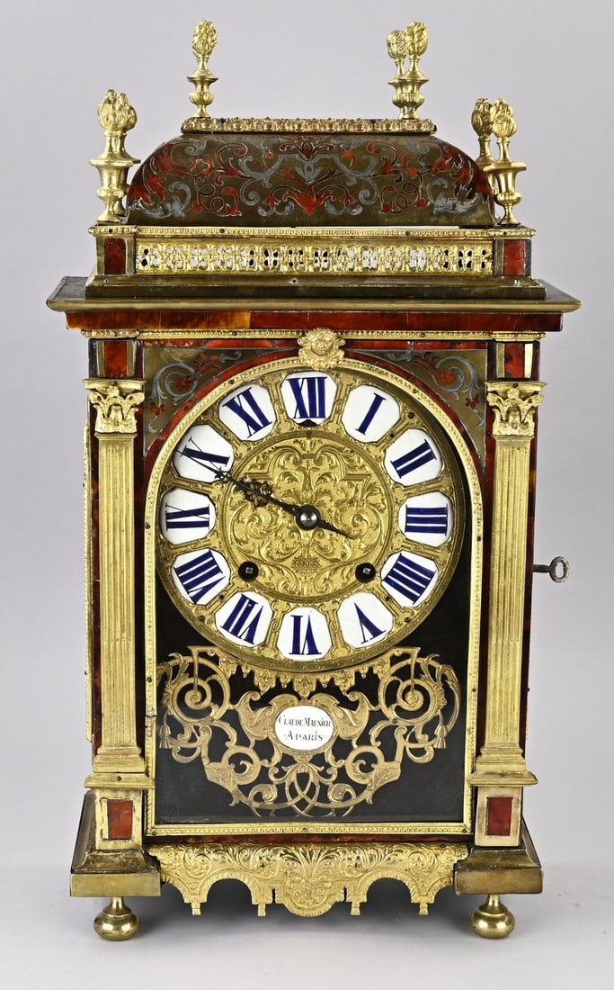 18th-century Boulle clock: 18th-century, religious French Boulle pendulum clock. By Claude Maunier, Paris. Converted to anchor escapement. Eight-day movement, half-hour strike. Dimensions: 60 cm. In good condition.