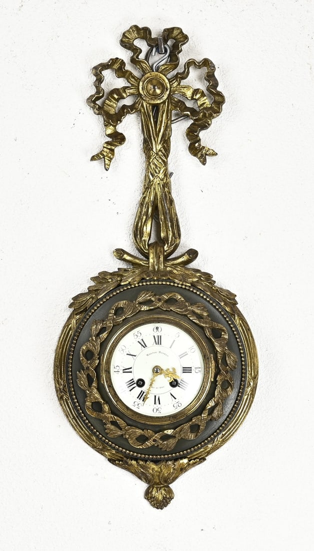 French cartel clock, 1870: 19th-century gilded bronze wall cartel clock in Louis XIV style. Circa 1870. Samuel Marti. Eight-day movement, half-hour strike, spring pendulum. Dimensions: 55 cm. In good condition.