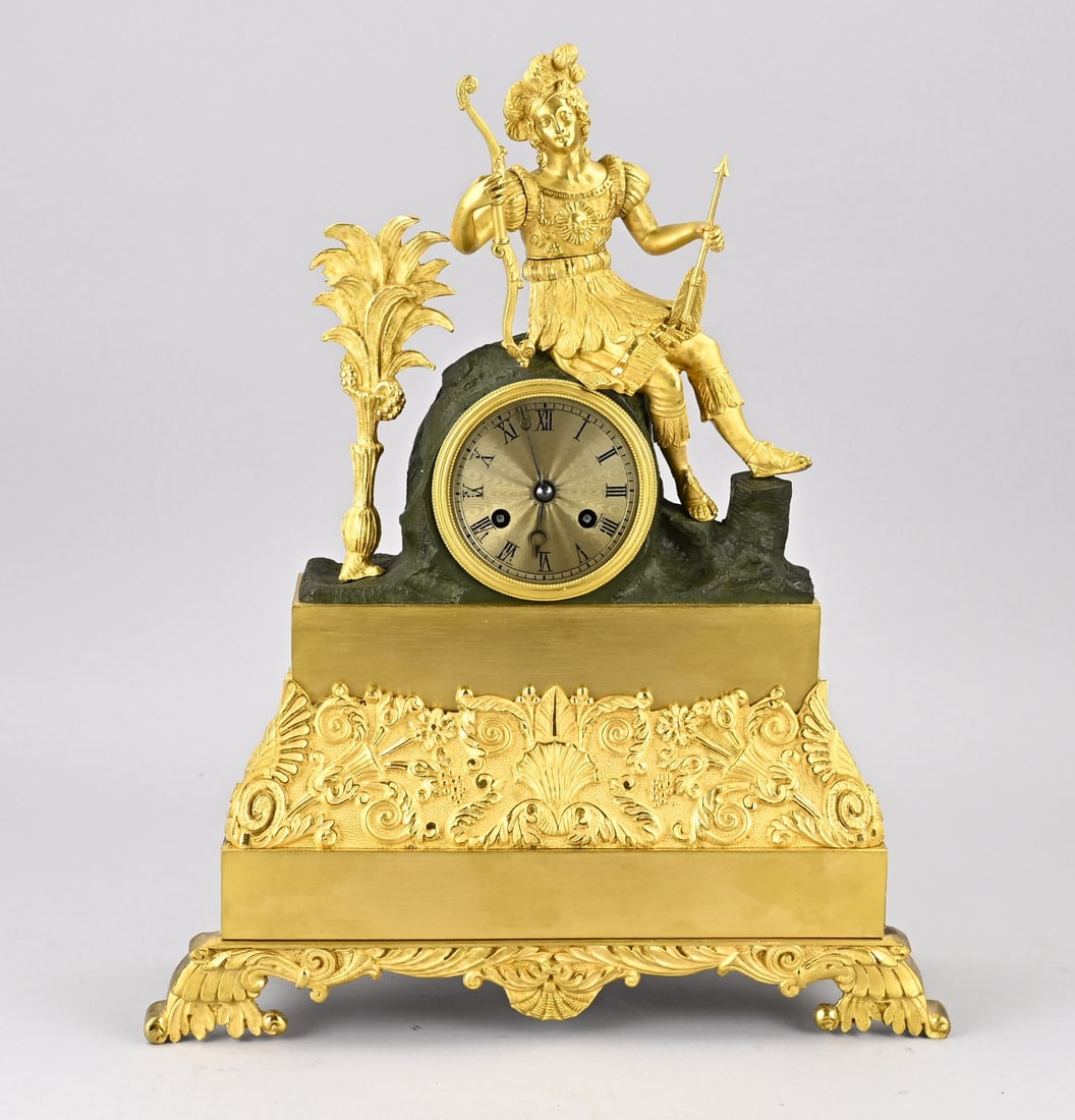 Charles Dix pendulum, H 41 cm.: Beautiful French, fire-gilded Charles Dix pendulum clock with an Inca figure holding a bow. Eight-day movement, half-hour strike, string pendulum. Dimensions: H 41 cm. In good condition.