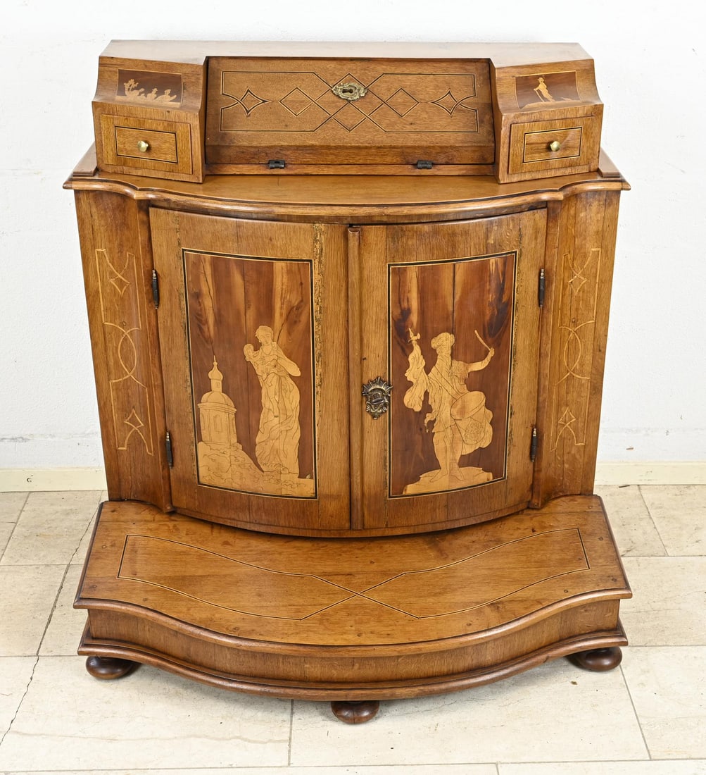 German tabernacle: Classicist, German, antique oak tabernacle with various religious intarsia depictions + intarsia band, also on the sides. Fitted with a prayer base. Dimensions: 105 x 175 x 97 cm. Older restoration.