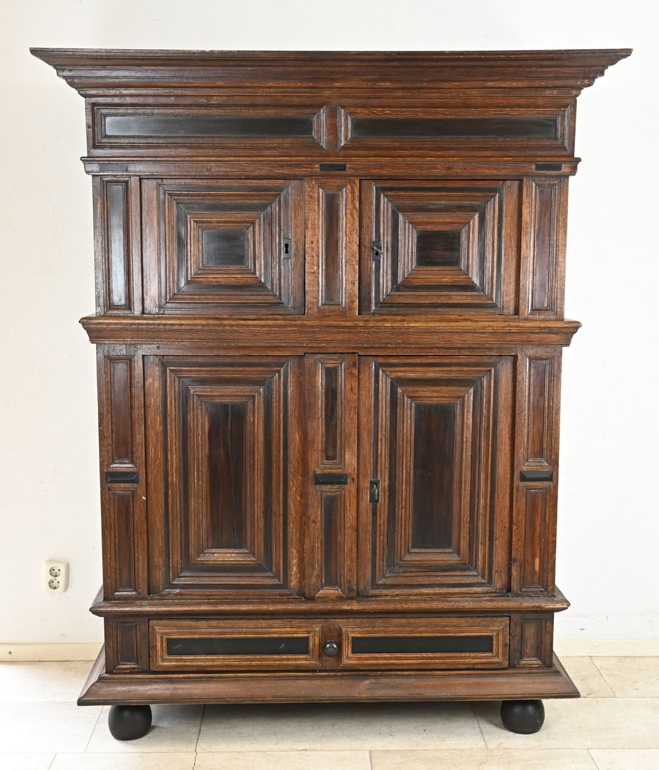 Renaissance panel cabinet: Antique Dutch Renaissance oak panel cabinet with ebony. Circa 1700. Four doors plus drawer and original wrought iron locks. Dimensions: 188 x 150 x 62 cm. In very good condition.