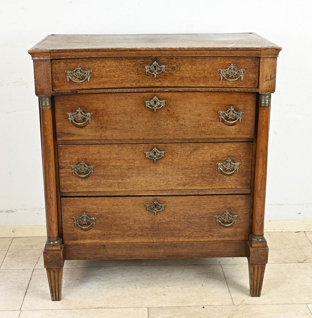 Oak Louis XVI chest of drawers: 18th-century Dutch Louis Seize oak commode with four drawers, solid columns, and original bronze fittings. Dimensions: 97 x 85 x 45 cm. In good condition.