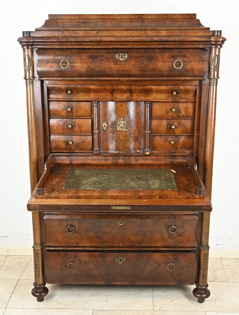 Mahogany secretary desk, 1840: Late Biedermeier mahogany secretary desk with columns and gilded bronze fittings and decorations. Germany. Circa 1840. Dimensions: 156 x 95 x 55 cm. Some damage. In reasonable condition.