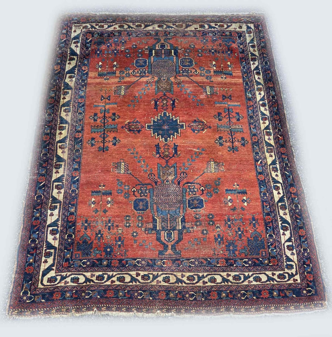 Persian rug, 195 x 145 cm.: Hand-knotted Persian rug. Color: red/blue, slightly worn, otherwise good. First half of the 20th century. Dimensions: 195 x 145 cm.