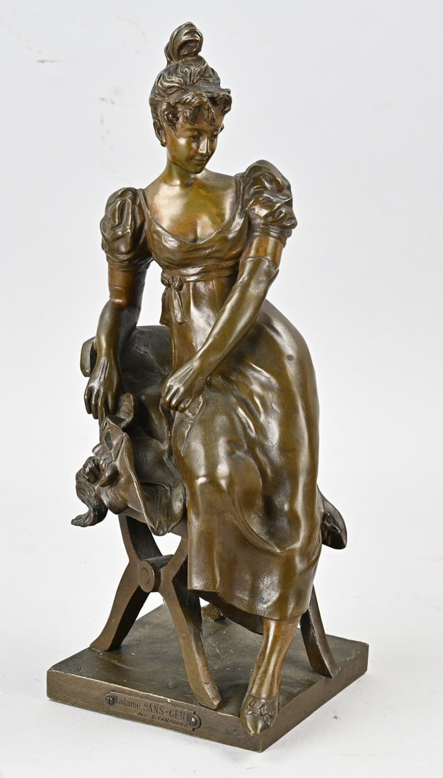 Statue, Lady in chair: Antique bronze figure. France. Circa 1900. Lady on a scissor chair, by D. Campagne. 1851 - 1914. Dimensions: 40 cm. In good condition.