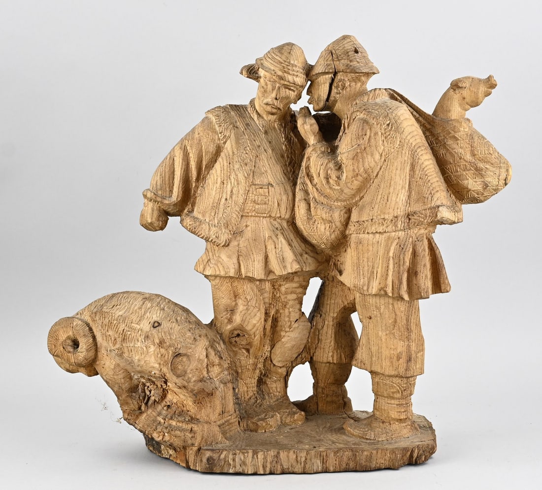Tyrolean sculpture group, 1930: Tyrolean sculpture group carved from ash wood. 2x Tyrolean man with ram and pig in backpack. Circa 1930. Dimensions: 48 x 43 x 18 cm. In good condition.