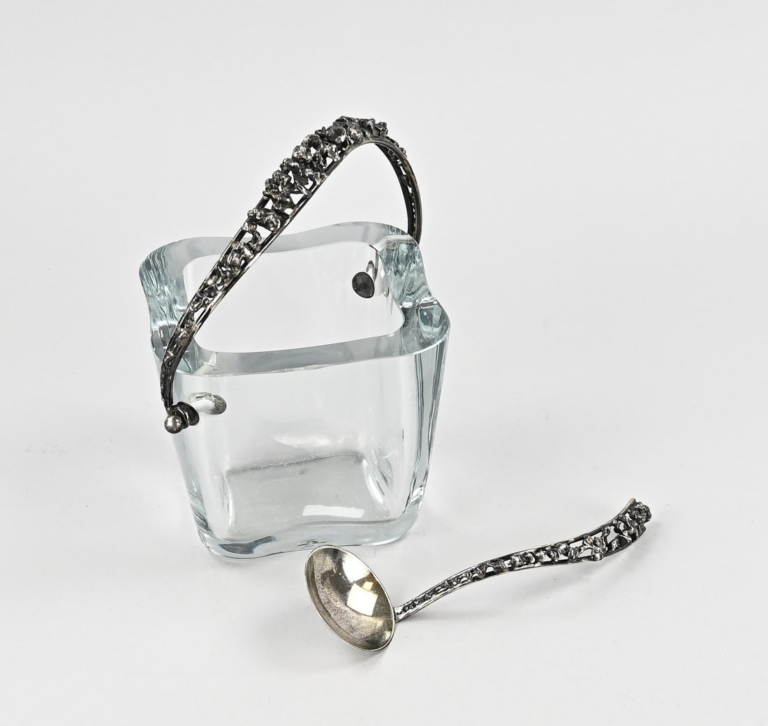 Glass coupe and cream spoon, Danish: Glass coupe with silver handle and spoon, Denmark, 925/000. Square contoured coupe with handle featuring a strike with soldered elements. With matching spoon. MT.: AAWeimar, Copenhagen 1937-1966. 2 sm