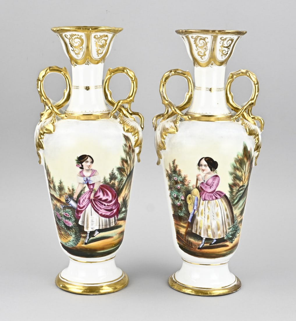 2x Decorative vase, H 36 cm.: Two 19th-century French porcelain ornamental vases. Decorated with women in a park and gold trim. Dimensions: H 36 cm. One vase has chips on the top rim that have been restored. In fair/good