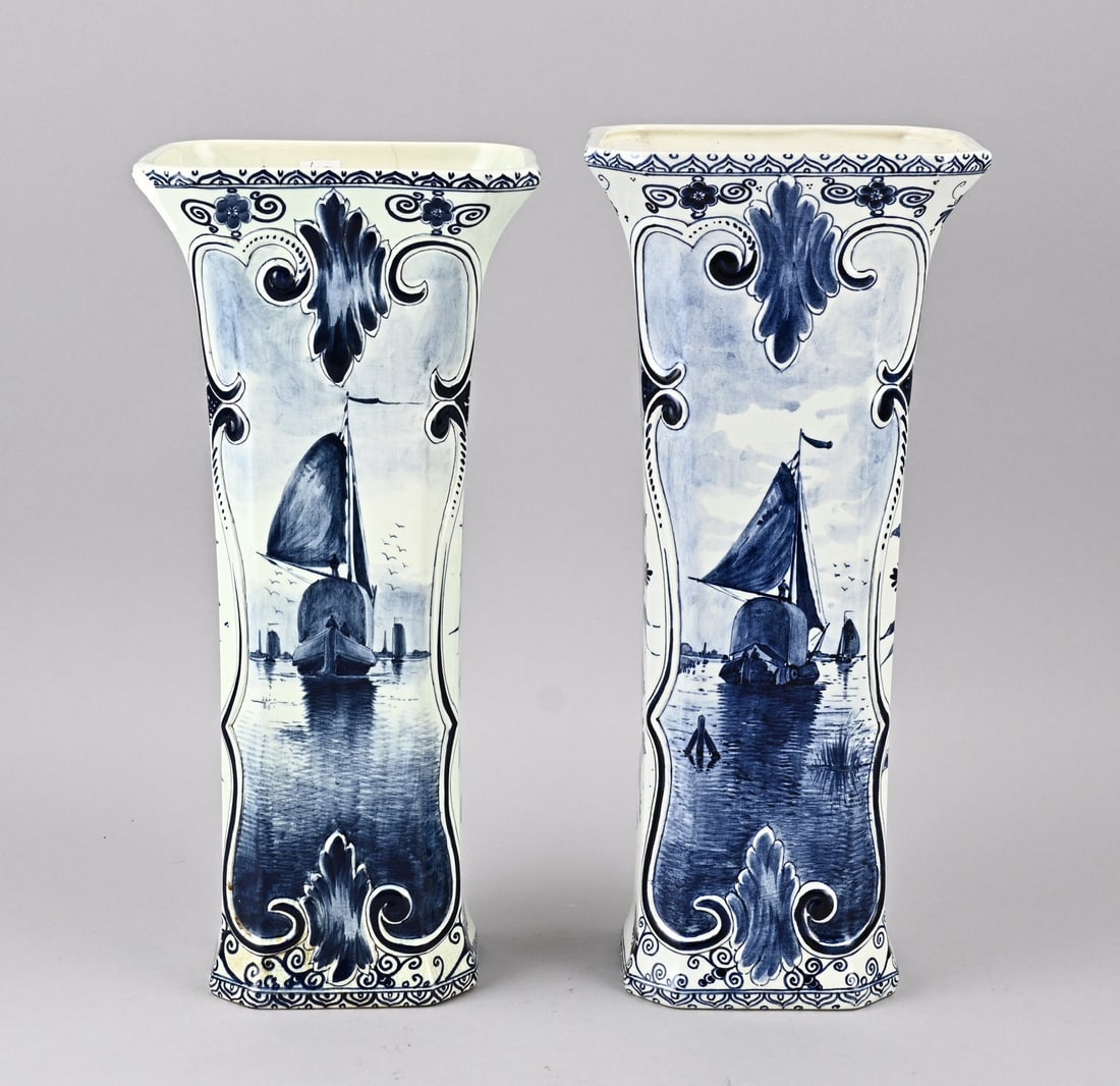 Two Delft vases, H 38.5 cm.: Two antique Delft faience vases with floral/sailboat decoration. Dimensions: H 38.5 cm. In good condition.