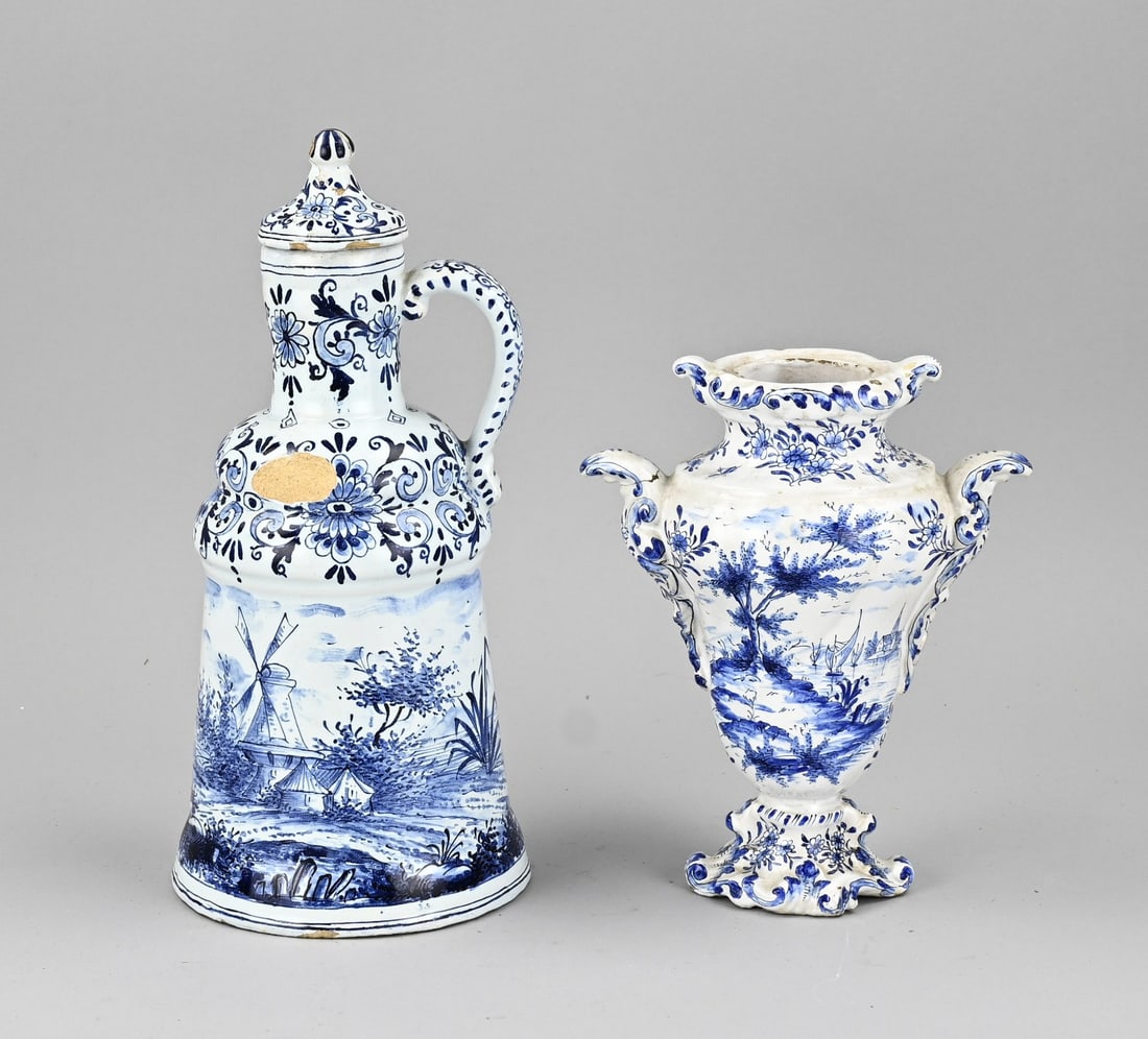 Delft carafe + vase, H 20 - 29 cm.: Two pieces of antique Dutch faience. Jug + vase. Delft? Base mark. Dimensions: H 20 - 29 cm. In good condition.