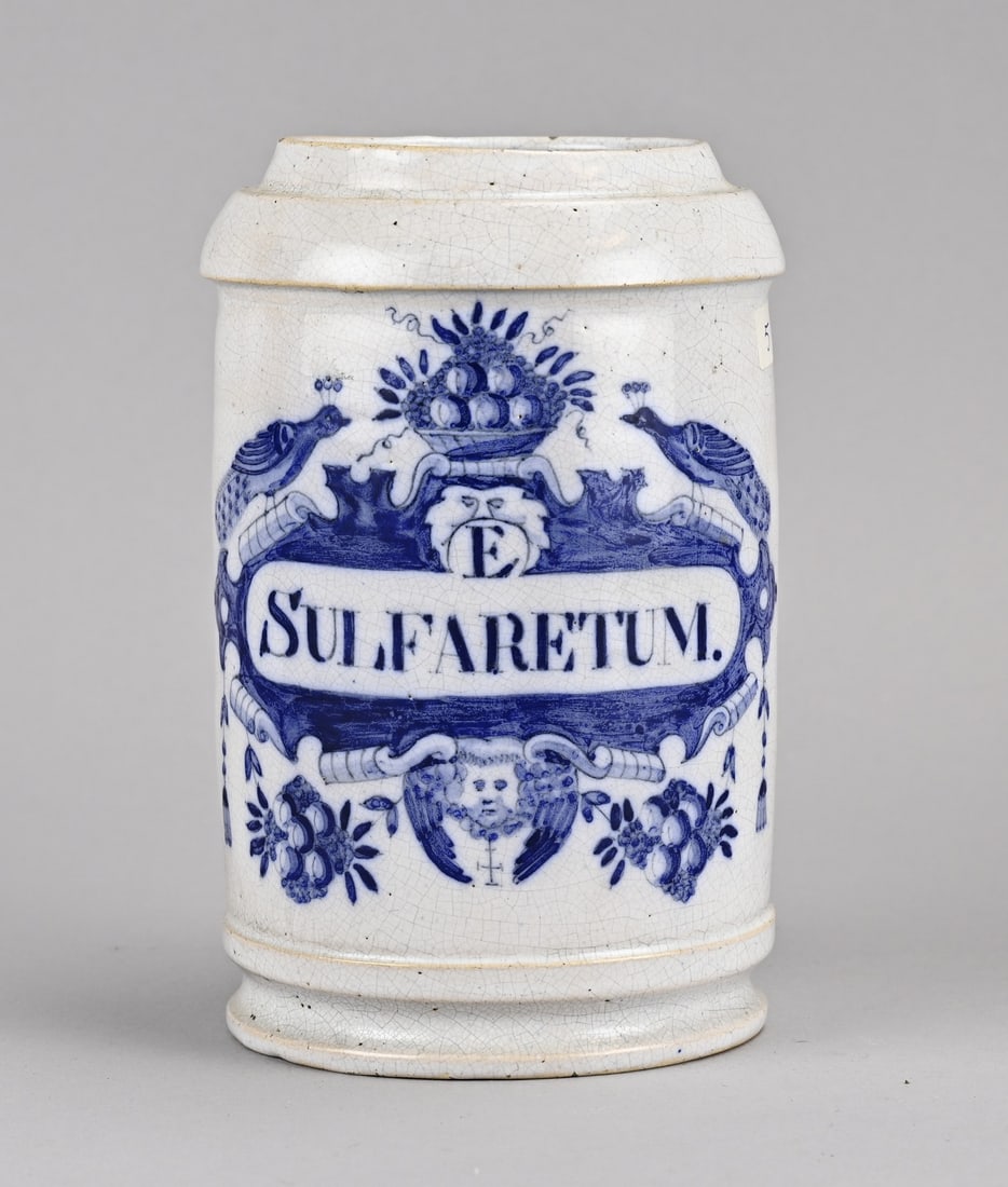 Apothecary jar/Albarello: 18th-century Dutch Delft apothecary jar with peacock decoration, Sulfaretum. Marked: the three bells. Dimensions: H 17.5 cm. In good condition.